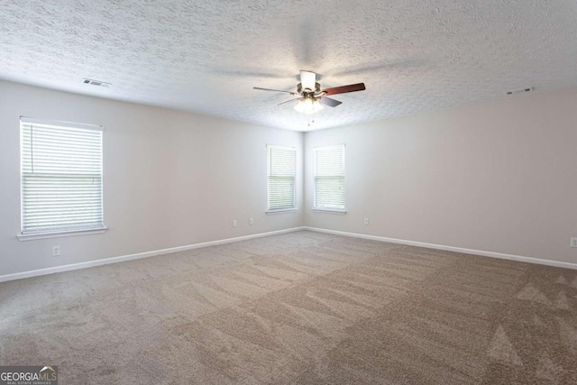 1924 Sweet Flag Rd, Lawrenceville, GA 30045 - carpeted empty room featuring ceiling fan, baseboards, and a textured ceiling