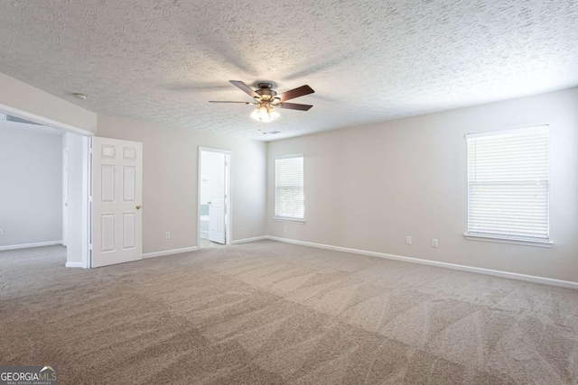1924 Sweet Flag Rd, Lawrenceville, GA 30045 - unfurnished room featuring a ceiling fan, carpet, baseboards, and a textured ceiling