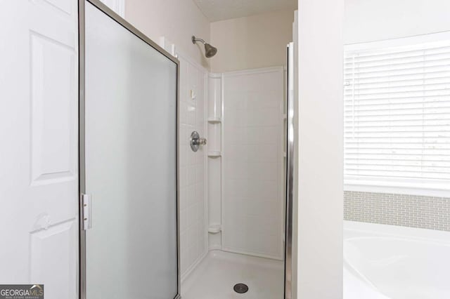 1924 Sweet Flag Rd, Lawrenceville, GA 30045 - bathroom with a shower stall and a garden tub