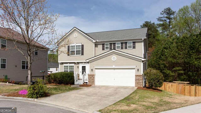 1924 Sweet Flag Rd, Lawrenceville, GA 30045 - traditional-style home featuring driveway, brick siding, and an attached garage