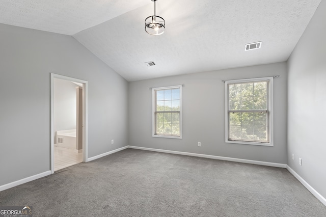 unfurnished bedroom featuring baseboards, carpet flooring, visible vents, and a textured ceiling