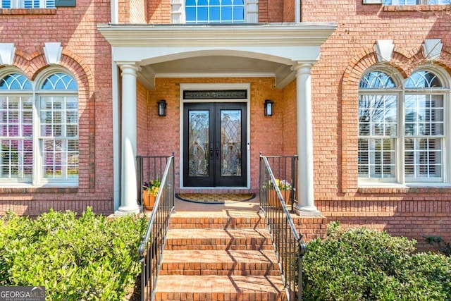 entrance to property with french doors and brick siding