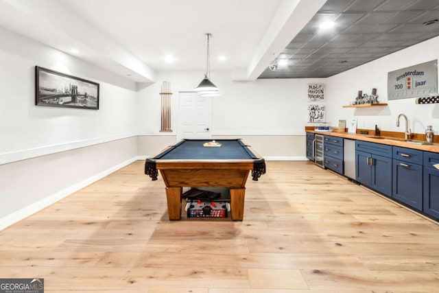 rec room with light wood finished floors, baseboards, wet bar, a sink, and pool table