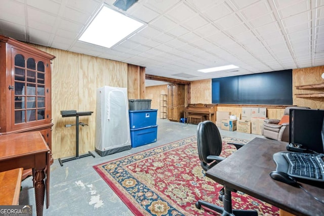 home office with wood walls