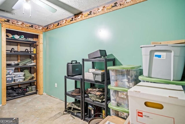 storage room featuring visible vents and ceiling fan