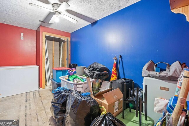 interior space with a closet, a textured ceiling, and ceiling fan