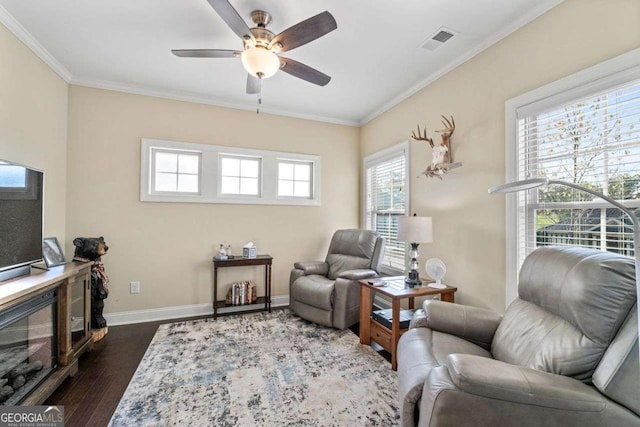 57 Cedarcrest Village Ln, Acworth, GA 30101 - living room featuring dark wood-style flooring, ceiling fan, ornamental molding, baseboards, and a glass covered fireplace
