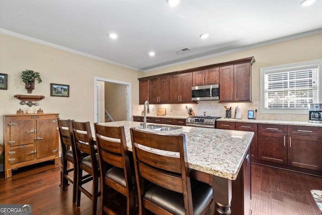 57 Cedarcrest Village Ln, Acworth, GA 30101 - kitchen featuring appliances with stainless steel finishes, a sink, crown molding, dark wood-style floors, and decorative backsplash