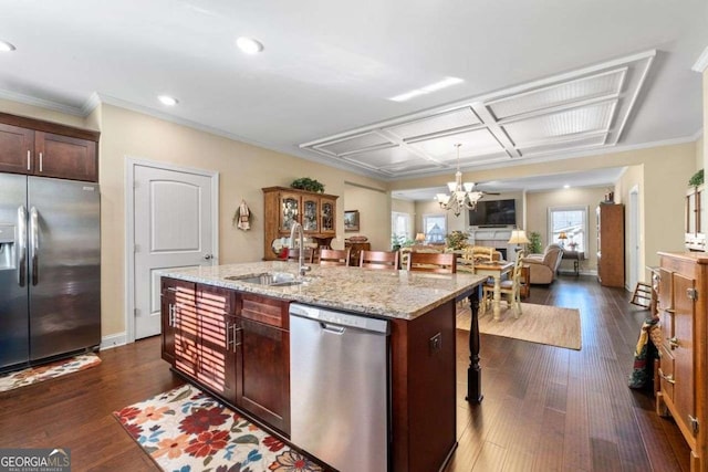 57 Cedarcrest Village Ln, Acworth, GA 30101 - kitchen with appliances with stainless steel finishes, a sink, a breakfast bar, open floor plan, and a chandelier