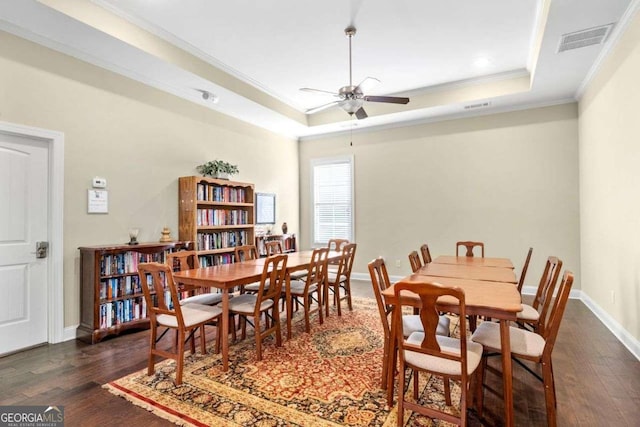 57 Cedarcrest Village Ln, Acworth, GA 30101 - dining area with a raised ceiling, ornamental molding, a ceiling fan, wood finished floors, and baseboards