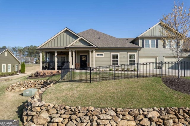 57 Cedarcrest Village Ln, Acworth, GA 30101 - craftsman-style home featuring board and batten siding, an attached garage, driveway, covered porch, and a ceiling fan