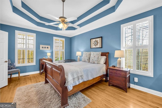 4463 N Gate Dr, Gainesville, GA 30506 - bedroom with multiple windows, wood finished floors, and a raised ceiling