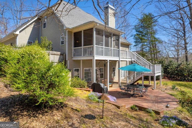 4463 N Gate Dr, Gainesville, GA 30506 - back of house featuring a chimney, a sunroom, stairs, and a patio