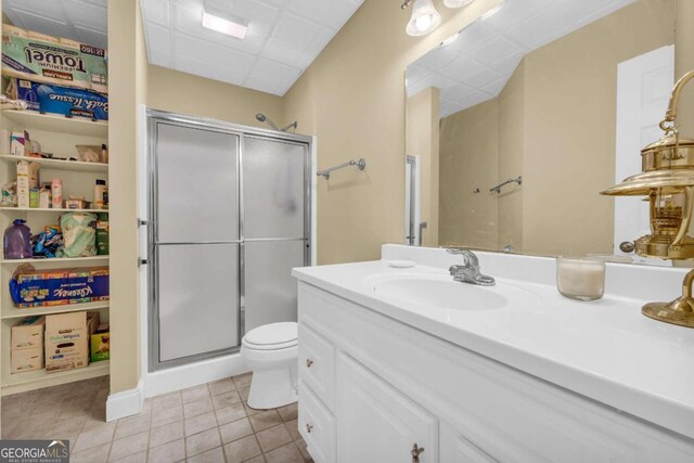 4463 N Gate Dr, Gainesville, GA 30506 - full bathroom featuring vanity, toilet, tile patterned floors, and a shower stall