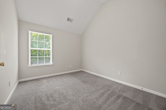 60 Charlotte Blvd, Stockbridge, GA 30281 - carpeted empty room featuring baseboards, vaulted ceiling, and visible vents
