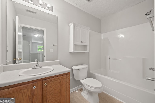 60 Charlotte Blvd, Stockbridge, GA 30281 - full bathroom featuring visible vents, toilet, vanity, baseboards, and a textured ceiling