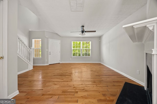 60 Charlotte Blvd, Stockbridge, GA 30281 - unfurnished living room featuring ceiling fan, a textured ceiling, visible vents, and light wood-type flooring