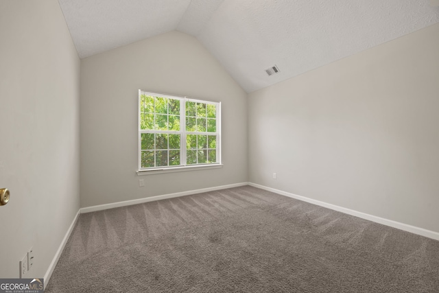 60 Charlotte Blvd, Stockbridge, GA 30281 - carpeted empty room with lofted ceiling, visible vents, and baseboards