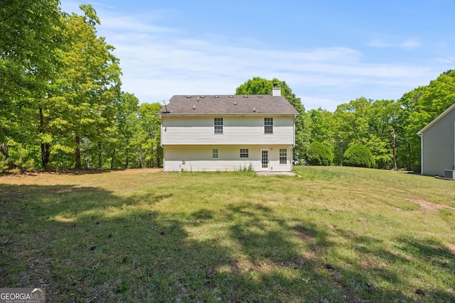 60 Charlotte Blvd, Stockbridge, GA 30281 - rear view of property with a yard and a chimney