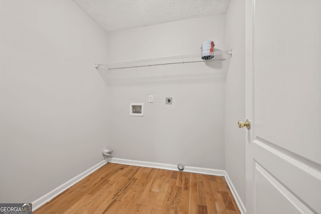 60 Charlotte Blvd, Stockbridge, GA 30281 - laundry room with hookup for an electric dryer, light wood-type flooring, baseboards, laundry area, and washer hookup