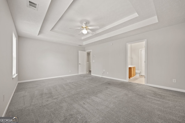 60 Charlotte Blvd, Stockbridge, GA 30281 - carpeted spare room featuring a raised ceiling, visible vents, baseboards, and ceiling fan