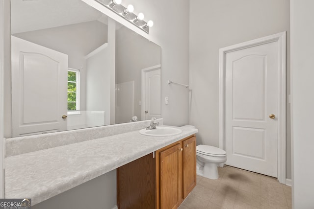 60 Charlotte Blvd, Stockbridge, GA 30281 - bathroom with lofted ceiling, vanity, and toilet