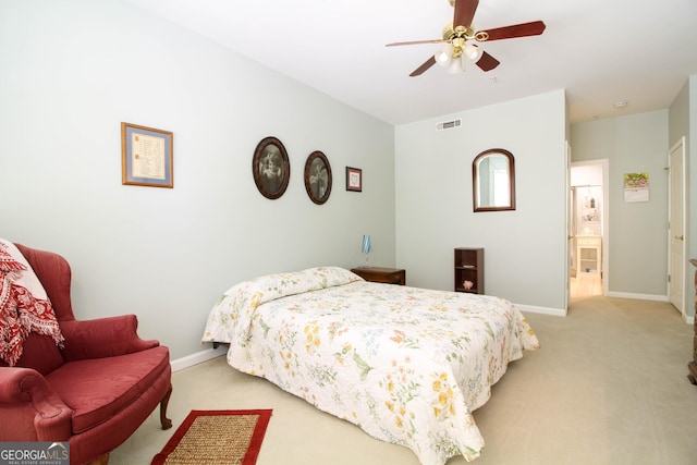 bedroom featuring a ceiling fan, baseboards, light colored carpet, and visible vents