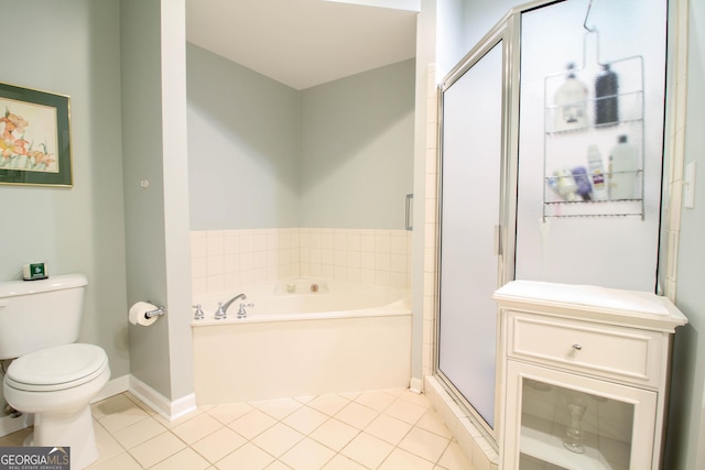 bathroom with a stall shower, tile patterned floors, toilet, a garden tub, and baseboards