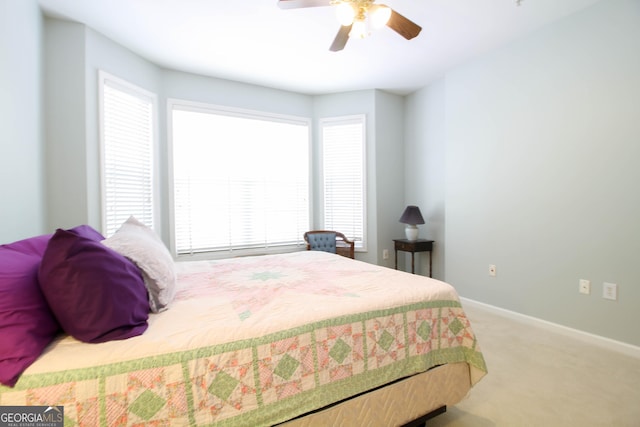 bedroom with baseboards, ceiling fan, and carpet flooring