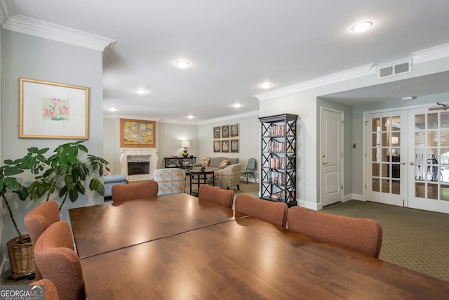 dining area featuring recessed lighting, french doors, ornamental molding, visible vents, and a high end fireplace