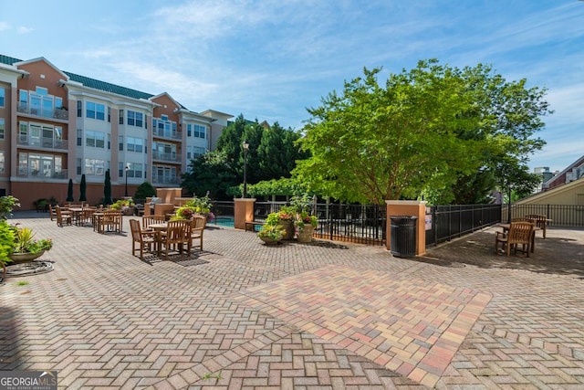 view of patio / terrace featuring fence