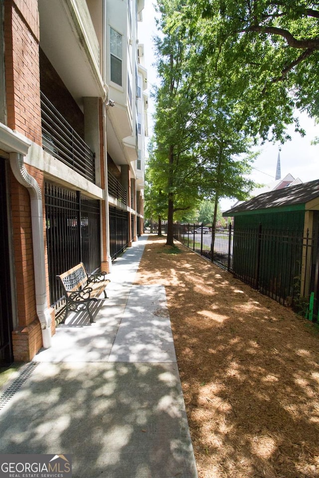 view of community with fence