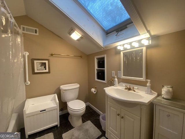 364 Cardinal Ln, Toccoa, GA 30577 - bathroom featuring lofted ceiling, vanity, toilet, radiator heating unit, and baseboards