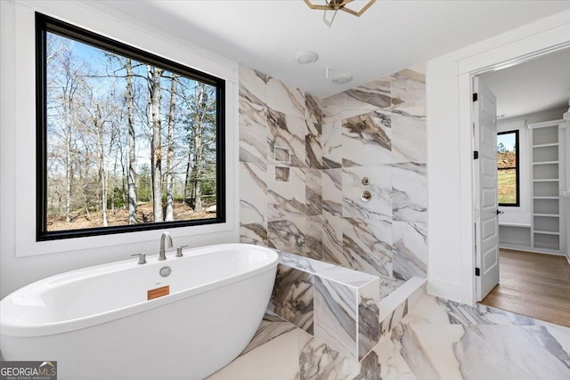 100 Forest Pl, Forsyth, GA 31029 - full bathroom with a freestanding bath, a walk in shower, and marble finish flooring