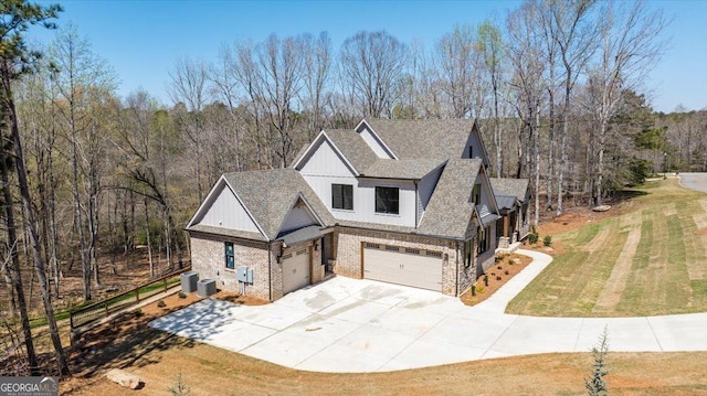100 Forest Pl, Forsyth, GA 31029 - view of front of home with an attached garage, concrete driveway, a front yard, a shingled roof, and central AC