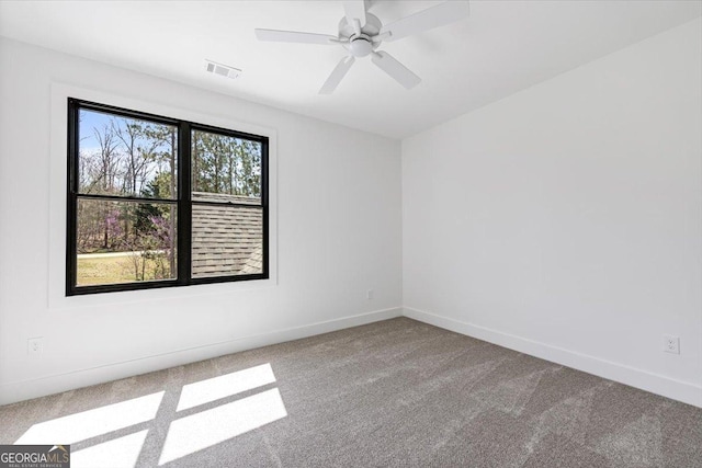 100 Forest Pl, Forsyth, GA 31029 - carpeted spare room with baseboards and a ceiling fan