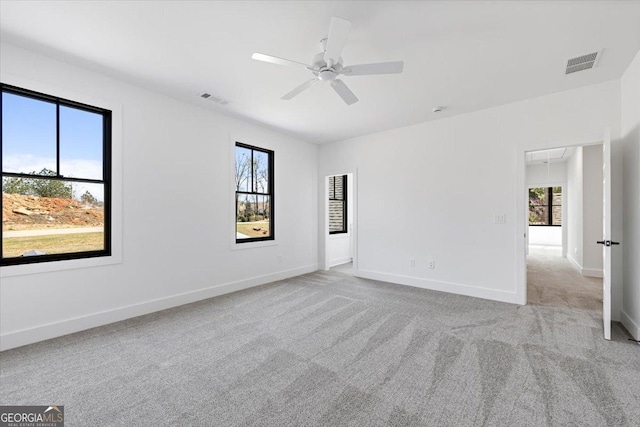 100 Forest Pl, Forsyth, GA 31029 - carpeted empty room with attic access, plenty of natural light, a ceiling fan, and baseboards