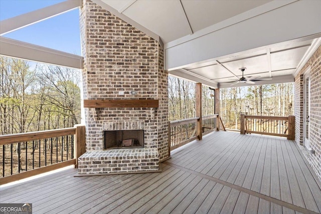 100 Forest Pl, Forsyth, GA 31029 - wooden deck featuring an outdoor brick fireplace and a ceiling fan