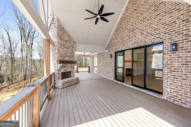 100 Forest Pl, Forsyth, GA 31029 - wooden terrace with a ceiling fan and an outdoor brick fireplace