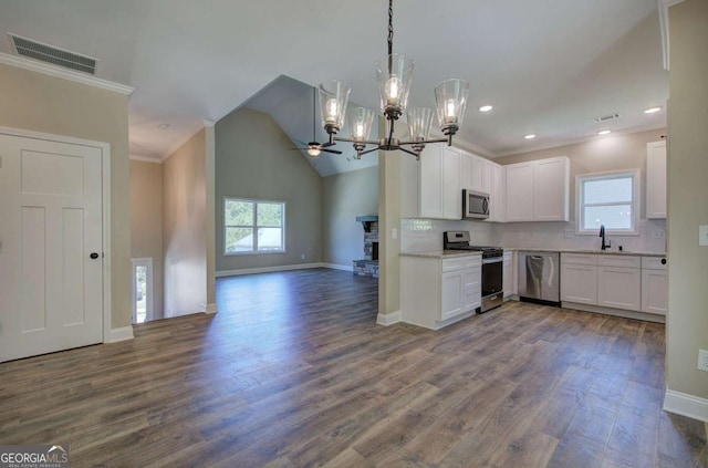 kitchen featuring visible vents, stainless steel appliances, a healthy amount of sunlight, and a sink
