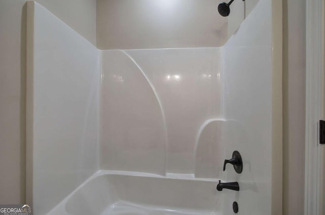 bathroom with shower / tub combination