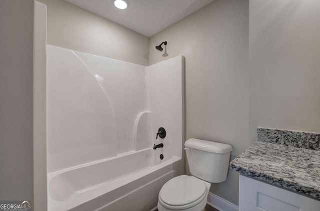 full bath with toilet, shower / bathing tub combination, and baseboards