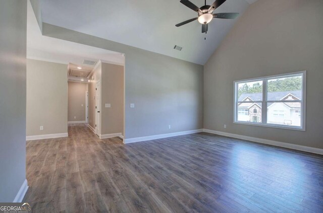 empty room featuring visible vents, wood finished floors, ceiling fan, and high vaulted ceiling