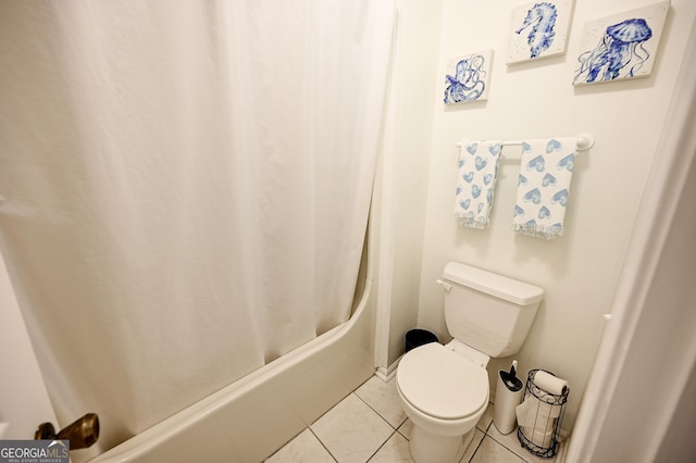 full bathroom featuring toilet, tile patterned flooring, and shower / bath combo