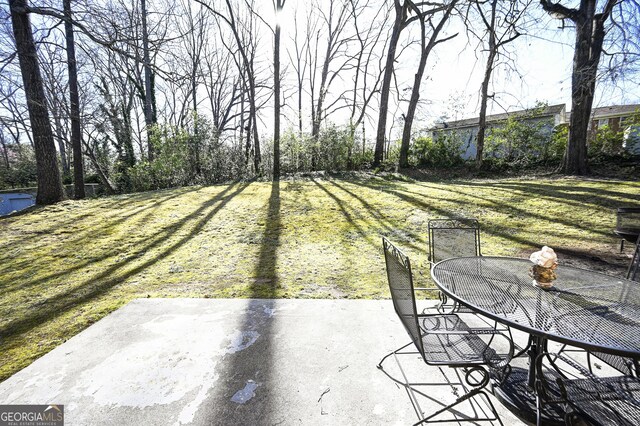 view of patio featuring outdoor dining area