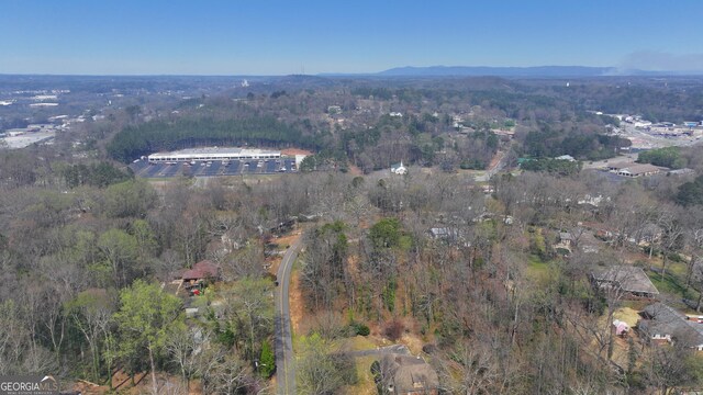 aerial view featuring a mountain view and a forest view