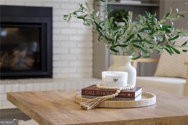 details featuring a brick fireplace