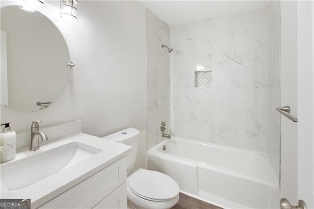 full bath with toilet, vanity, and shower / tub combination