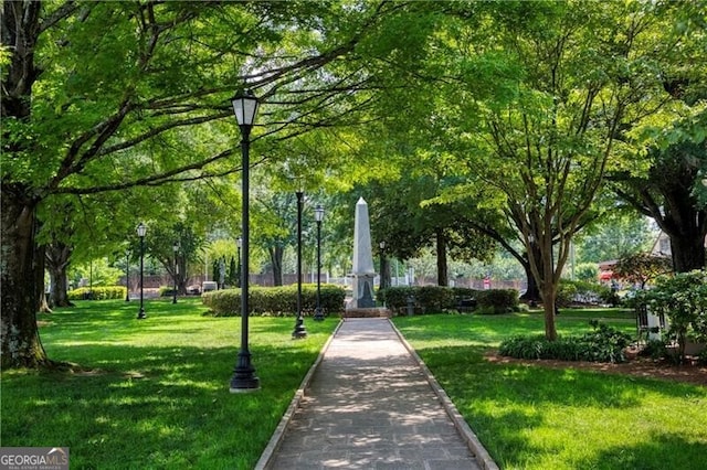 view of property's community featuring a yard