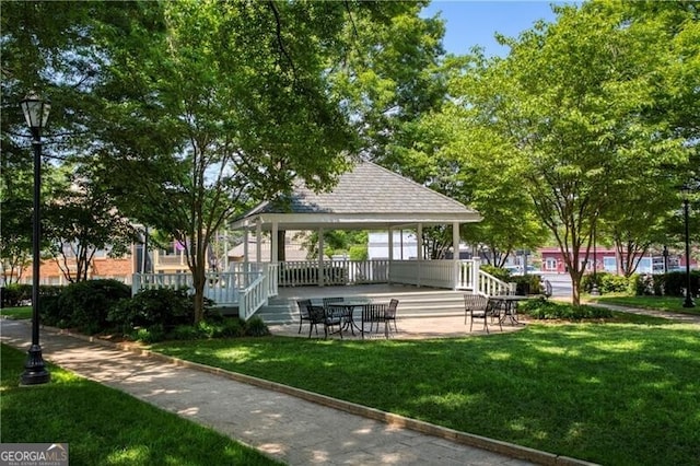 view of property's community with a lawn and a gazebo
